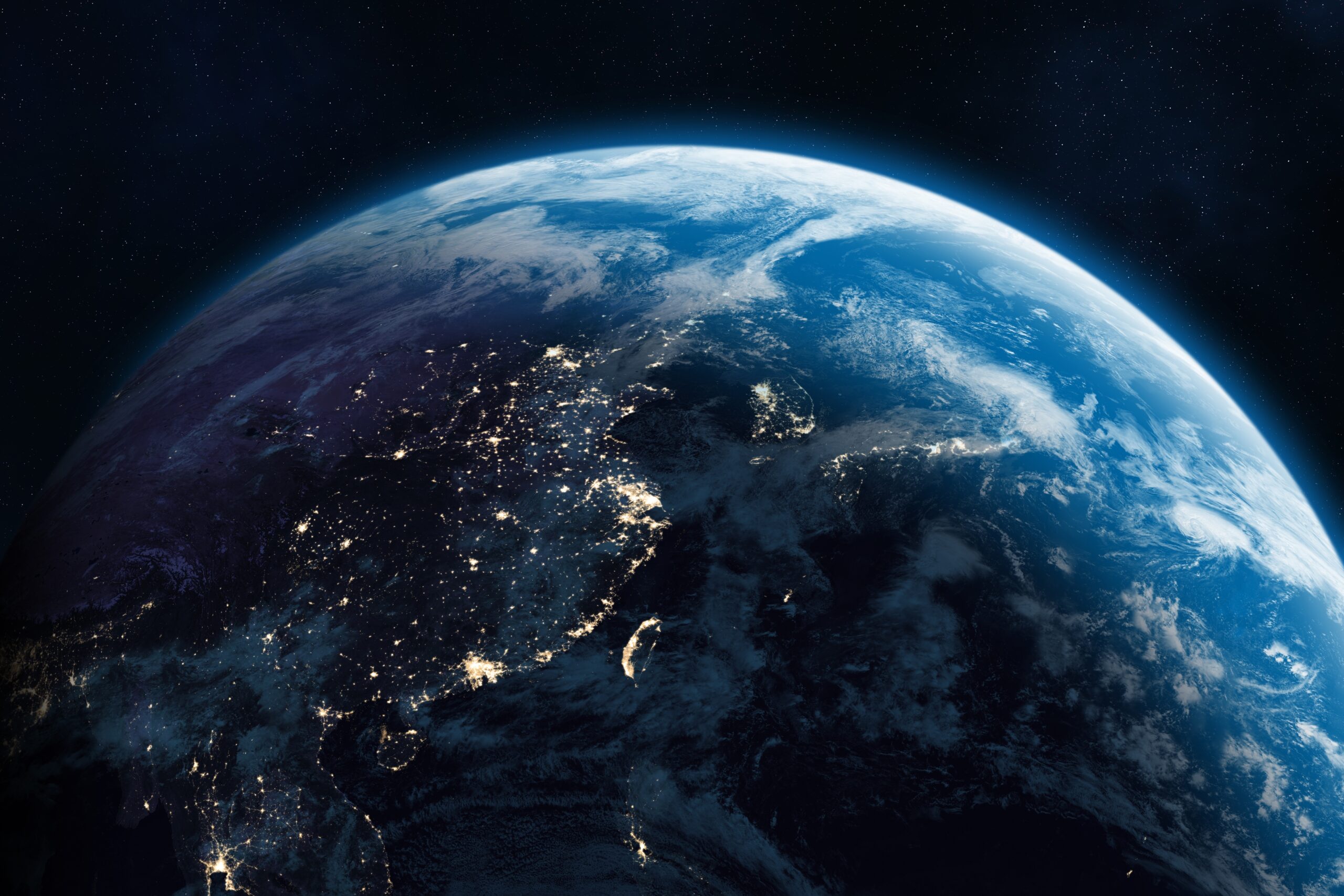 Night-time image of the Earth showing city lights, symbolising global ETFs and the most popular ETFs bought by UK investors in 2025